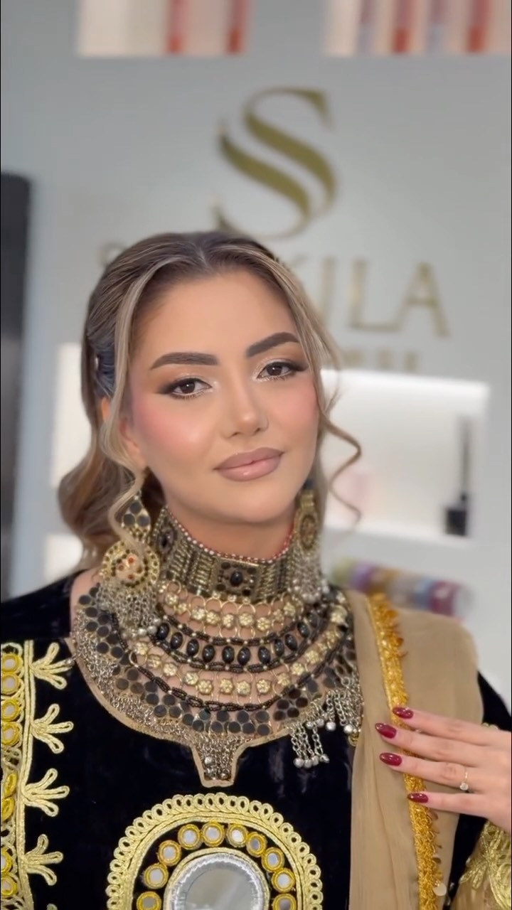 Tikka and headpiece: Jewelled, set into the hair