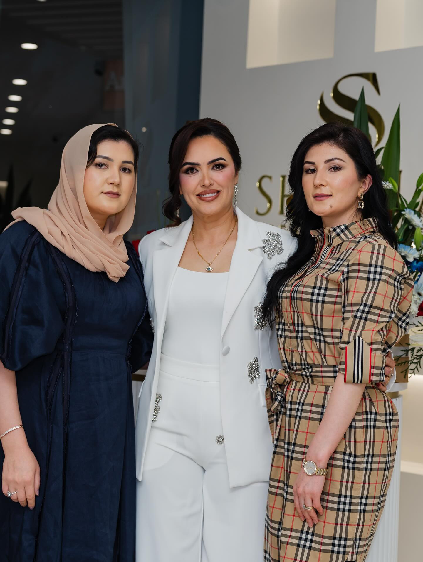 Shakila with guests under the chandeliers on opening day